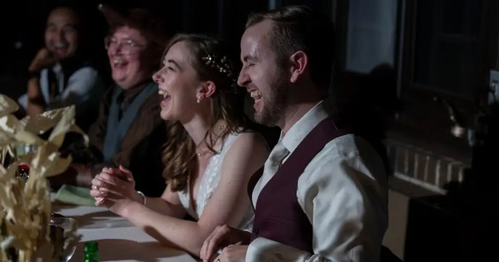 Bride and Groom laughing during the toasts