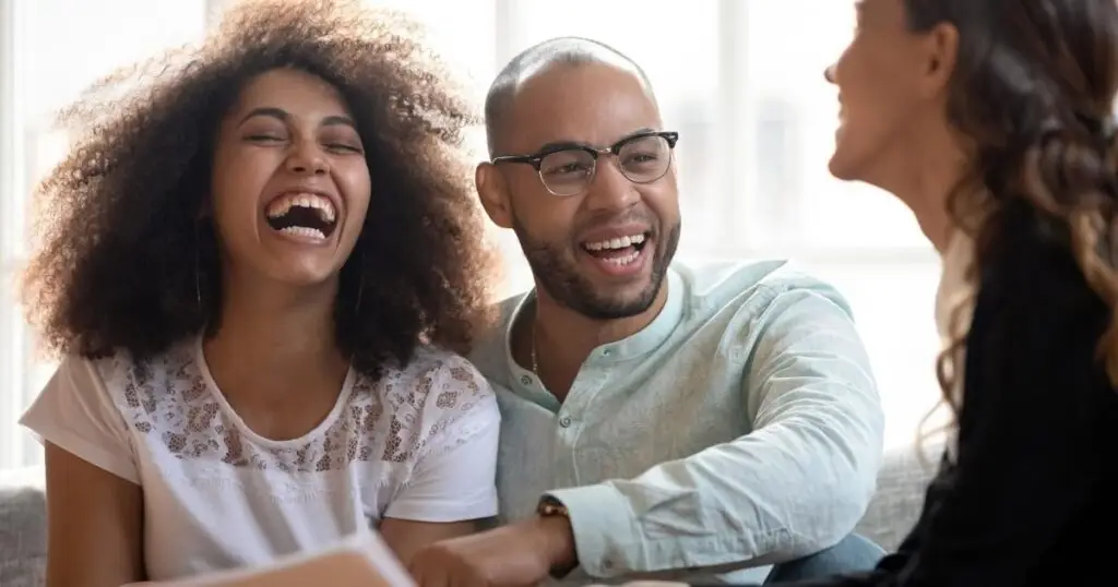 Couple laughing with their wedding planner