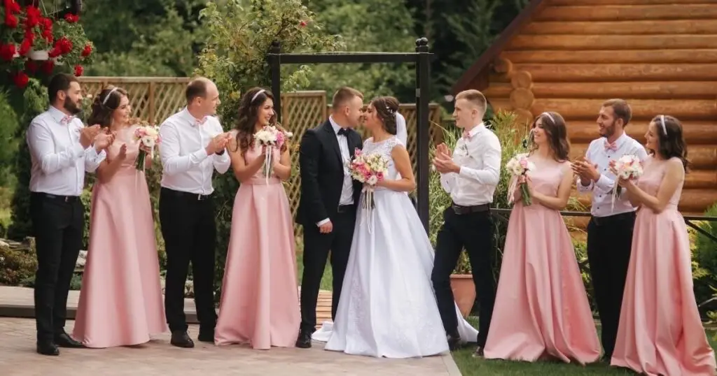 Bride and groom surrounded by their wedding party