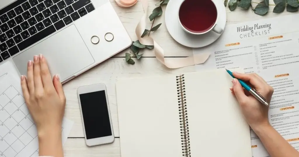 Wedding planning on a laptop while drinking tea