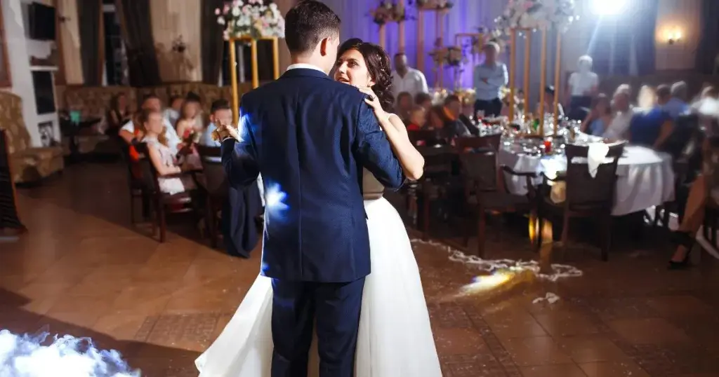 Couple dances while their first dance song plays.