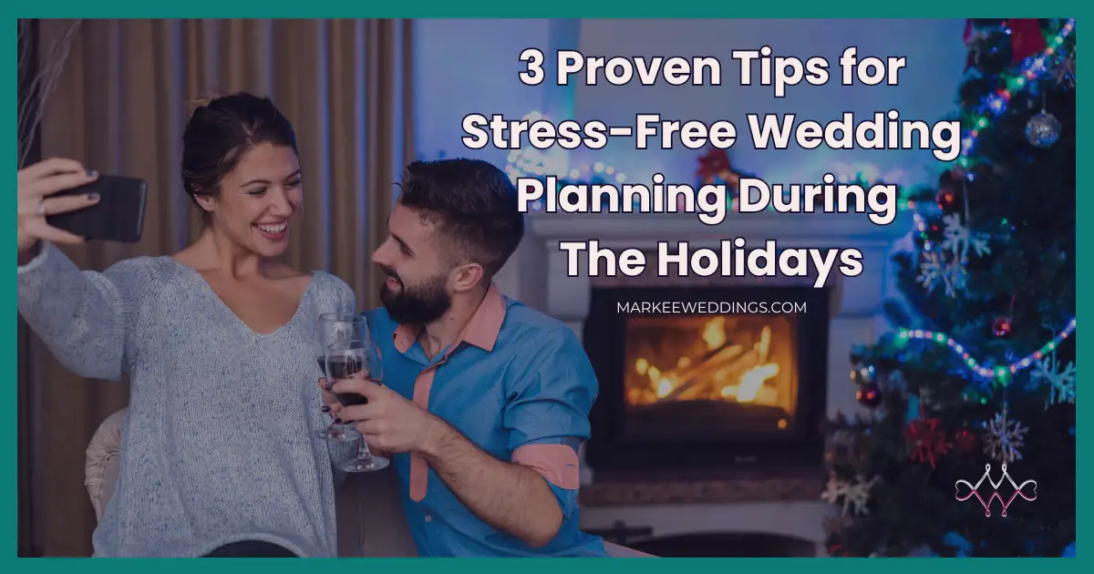 Relaxed couple taking a selfie by a cozy fireplace and Christmas tree, enjoying a stress-free moment during wedding planning during the holidays.