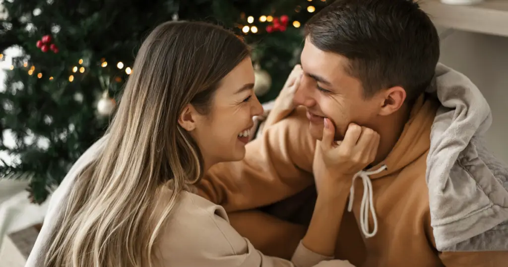 Couple laughing together during the holidays